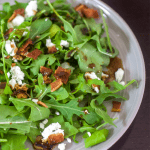 Arugula Salad with Warm Bacon Vinaigrette and Goat Cheese