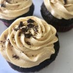 Plate of mexican chocolate cupcakes topped with dulce de leche buttercream