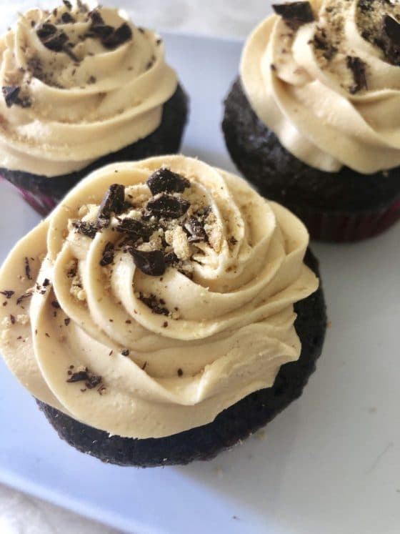 Plate of mexican chocolate cupcakes topped with dulce de leche buttercream