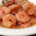 bowl of shrimp scampi with beer