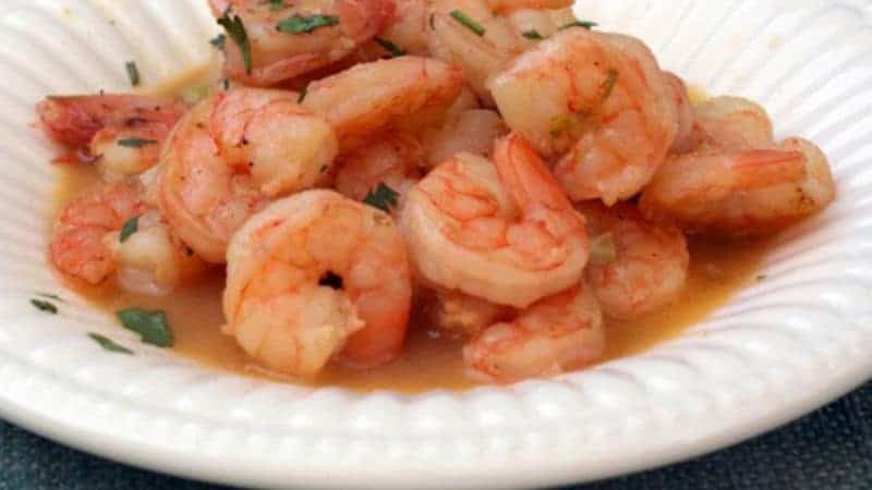 Bowl of Shrimp Scampi with beer. 