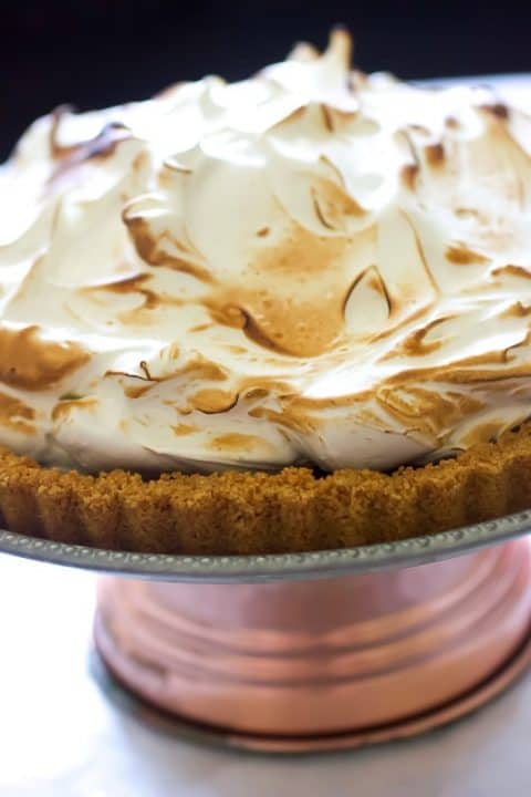 Close up view of Chocolate S'mores Tart topped with a toasted marshmallow meringue.
