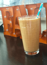 glass filled with Pumpkin Spice Protein Shake.