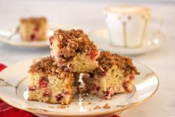 plate stacked with cranberry streusel coffee cake