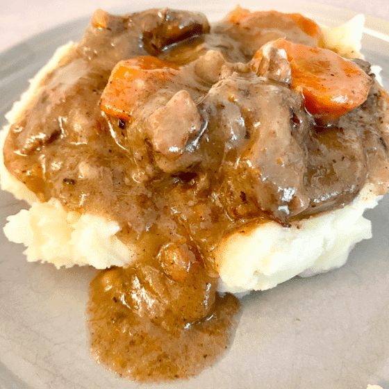 Ina's Beef Bourguignon served over creamy mashed potatoes.