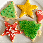 plate of sugar cookies topped with Vegan Buttercream frosting