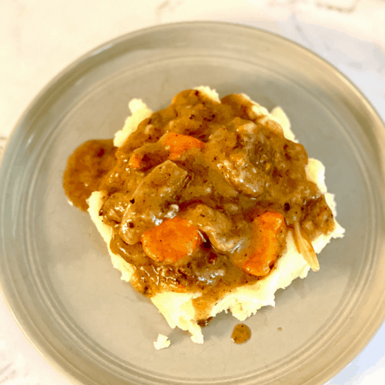 photo of beef bourginon over mashed potatoes