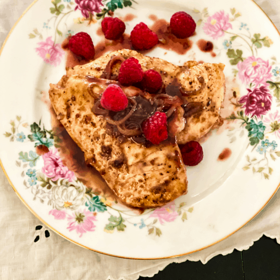 Raspberry Balsamic Chicken on a floral plate.