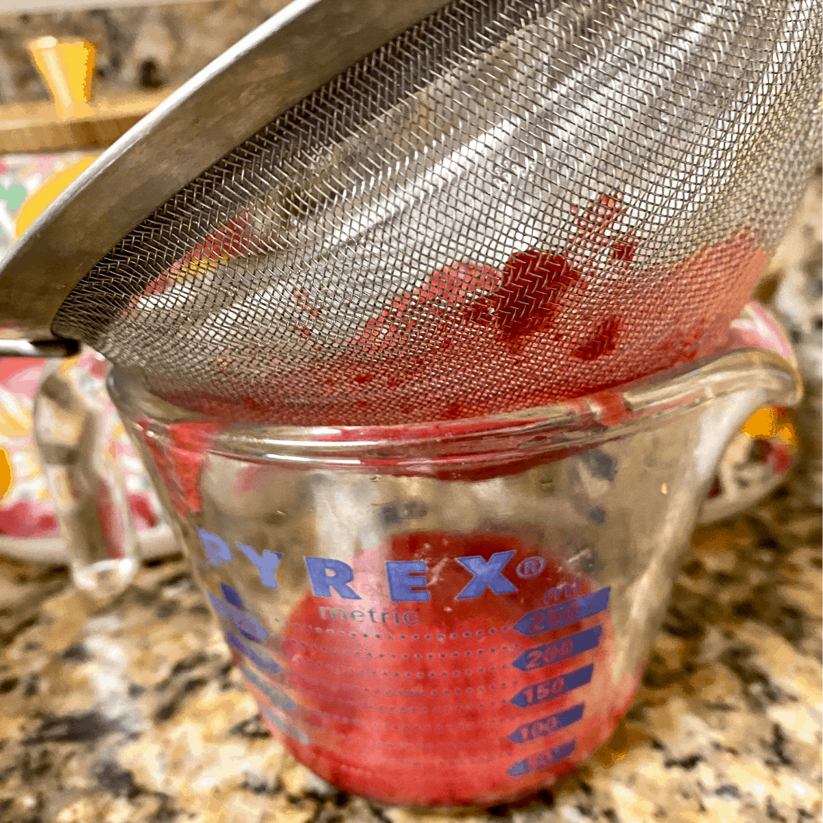 Raspberry pushed through sieve for Raspberry Balsamic Chicken