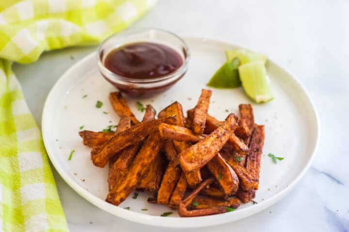 white plate with baked sweet potato fries