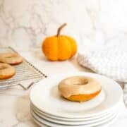 Pumpkin spice latte donut on a white plate