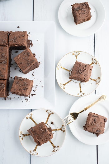 Overview of chocolate snack cake on white and gold plates